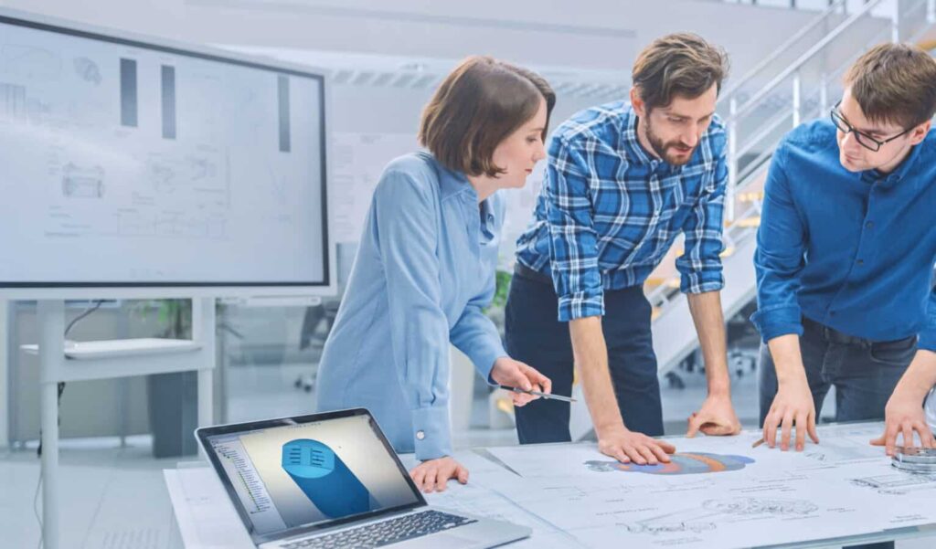 in the industrial engineering facility: diverse group of enginee